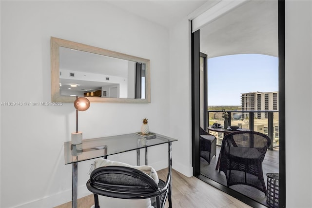 121 NE 34th St Unit 1514, Miami, FL 33137 - office area featuring light wood finished floors and baseboards