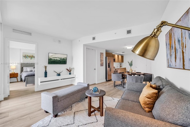 121 NE 34th St Unit 1514, Miami, FL 33137 - living area featuring light wood-style floors