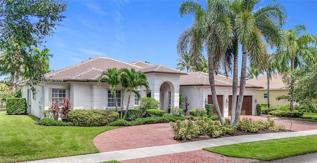 4268 SW 141st Ave, Davie, FL 33330 - view of front facade with a tiled roof, decorative driveway, and stucco siding