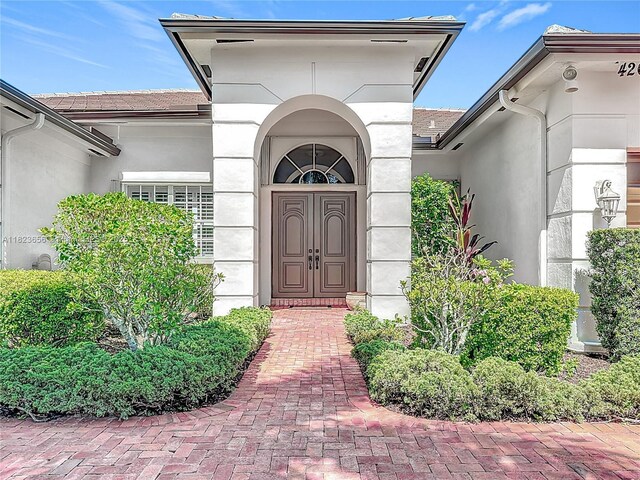 4268 SW 141st Ave, Davie, FL 33330 - view of exterior entry featuring stucco siding