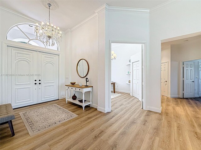 4268 SW 141st Ave, Davie, FL 33330 - foyer entrance featuring a chandelier, crown molding, and light wood-style floors