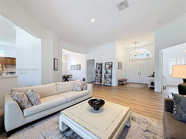 4268 SW 141st Ave, Davie, FL 33330 - living area with ornamental molding and light wood-style floors