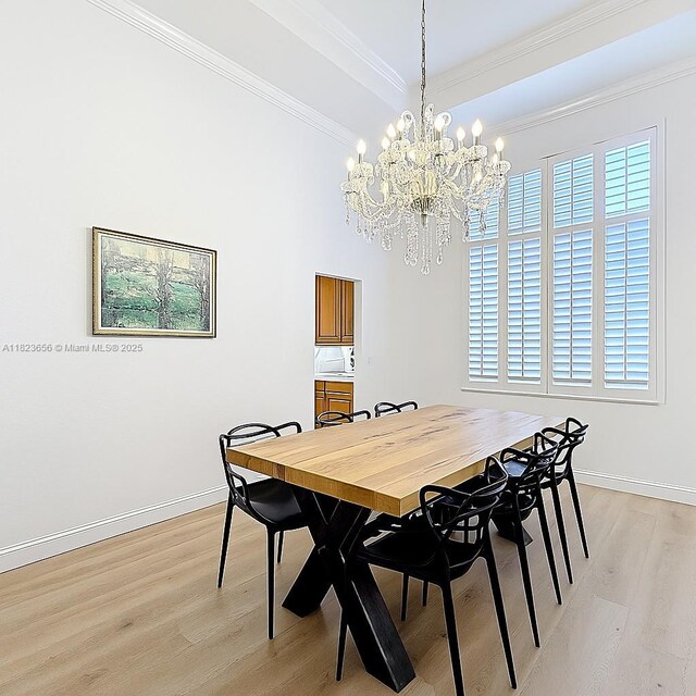 4268 SW 141st Ave, Davie, FL 33330 - dining area with light wood-style floors, crown molding, and a chandelier