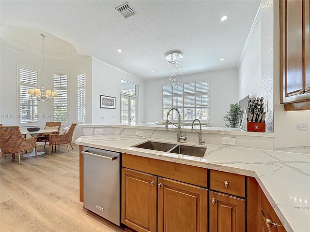 4268 SW 141st Ave, Davie, FL 33330 - kitchen with a chandelier, stainless steel dishwasher, ornamental molding, brown cabinetry, and light wood-style flooring