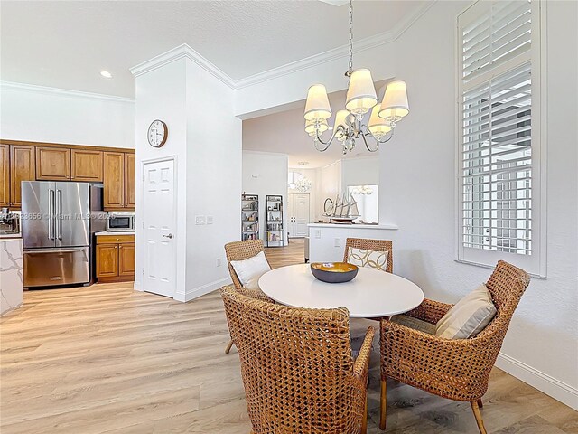 4268 SW 141st Ave, Davie, FL 33330 - dining room featuring a chandelier, crown molding, and light wood-style flooring
