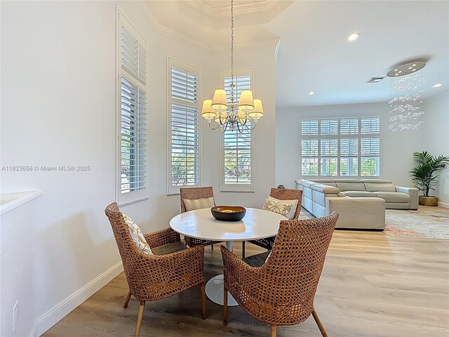 4268 SW 141st Ave, Davie, FL 33330 - dining area with a chandelier, light wood-style floors, recessed lighting, and crown molding