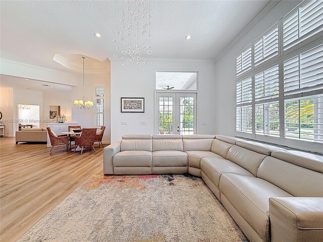 4268 SW 141st Ave, Davie, FL 33330 - living area with wood finished floors, a chandelier, recessed lighting, french doors, and a textured ceiling