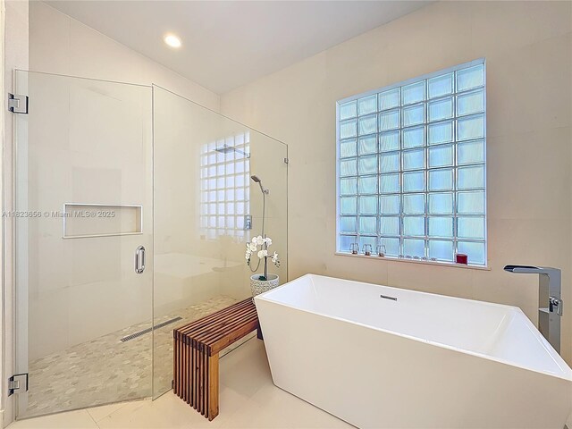 4268 SW 141st Ave, Davie, FL 33330 - full bath featuring a shower stall, a soaking tub, and tile patterned flooring