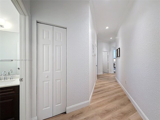 4268 SW 141st Ave, Davie, FL 33330 - corridor with a textured wall, light wood-style floors, and recessed lighting