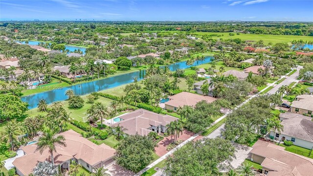 4268 SW 141st Ave, Davie, FL 33330 - aerial perspective of suburban area featuring a nearby body of water and a tree filled landscape