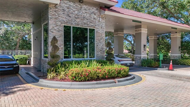 4268 SW 141st Ave, Davie, FL 33330 - view of front of property with an attached garage, decorative driveway, a tile roof, and stucco siding