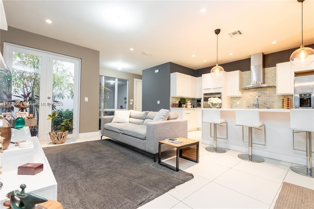 10555 NW 64th Way, Doral, FL 33178 - living room featuring light tile patterned floors, recessed lighting, and french doors