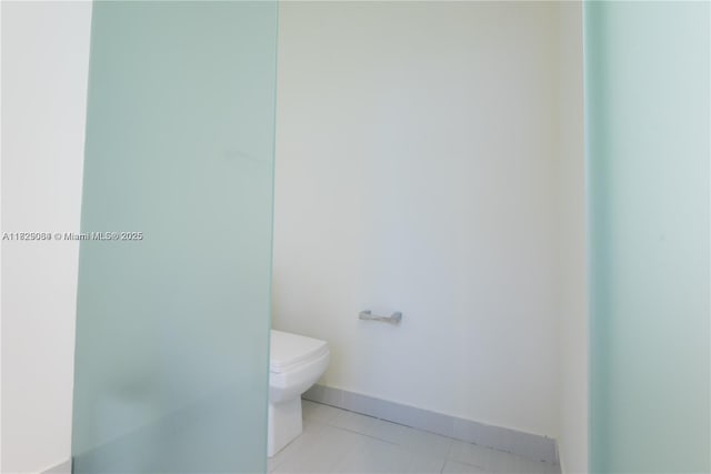 10555 NW 64th Way, Doral, FL 33178 - bathroom featuring toilet and tile patterned floors