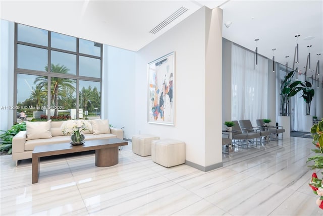 10555 NW 64th Way, Doral, FL 33178 - common area featuring floor to ceiling windows and a towering ceiling