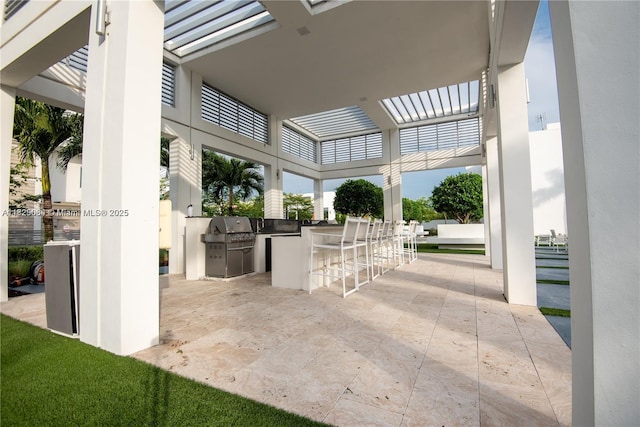10555 NW 64th Way, Doral, FL 33178 - view of patio / terrace featuring an outdoor kitchen and a pergola