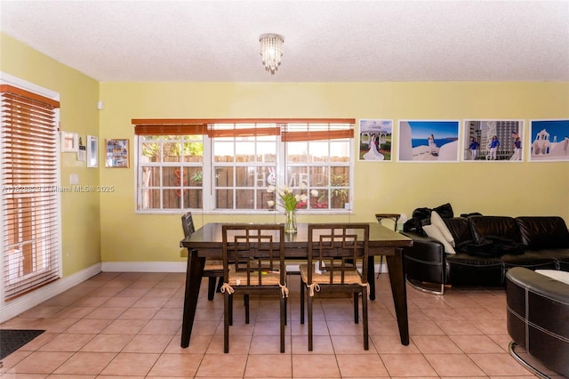 7081 SW 158th Ct, Miami, FL 33193 - dining space featuring light tile patterned flooring and a textured ceiling