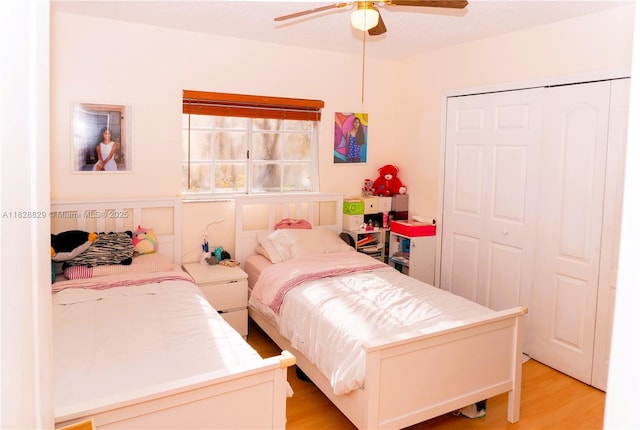 7081 SW 158th Ct, Miami, FL 33193 - bedroom with light wood-style flooring, a ceiling fan, and a closet