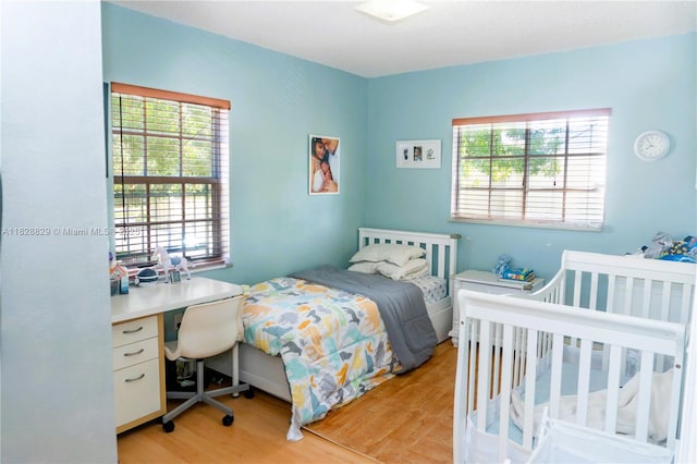 7081 SW 158th Ct, Miami, FL 33193 - bedroom featuring multiple windows and light wood-style flooring