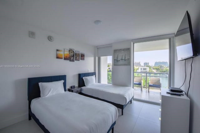 9261 E Bay Harbor Dr Unit 402, Bay Harbor Islands, FL 33154 - bedroom featuring access to exterior and a wall of windows