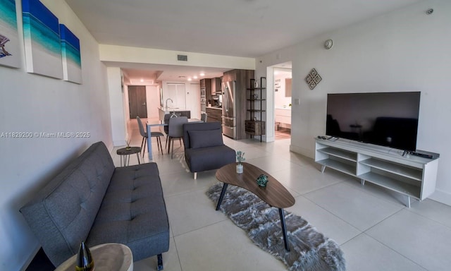 9261 E Bay Harbor Dr Unit 402, Bay Harbor Islands, FL 33154 - living room featuring light tile patterned floors