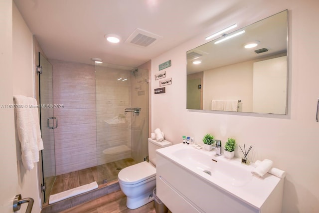 9261 E Bay Harbor Dr Unit 402, Bay Harbor Islands, FL 33154 - bathroom featuring a shower stall, vanity, wood finished floors, and recessed lighting