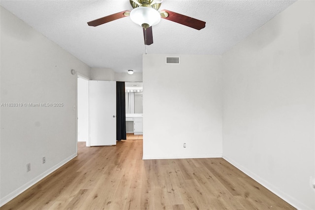 10501 W Broward Blvd Unit 304, Plantation, FL 33324 - spare room with a ceiling fan, light wood-style floors, and a textured ceiling