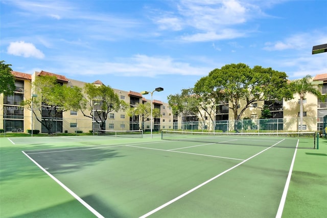 10501 W Broward Blvd Unit 304, Plantation, FL 33324 - view of tennis court featuring community basketball court