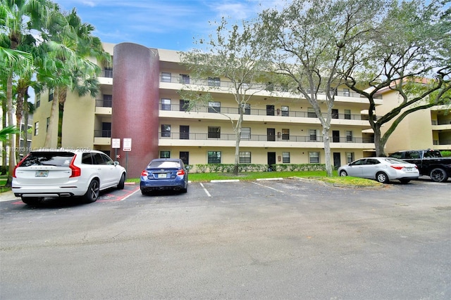 10501 W Broward Blvd Unit 304, Plantation, FL 33324 - view of apartment building / complex featuring uncovered parking