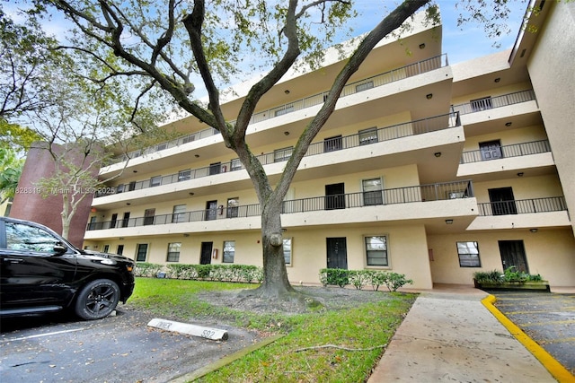 10501 W Broward Blvd Unit 304, Plantation, FL 33324 - view of apartment building / complex with uncovered parking