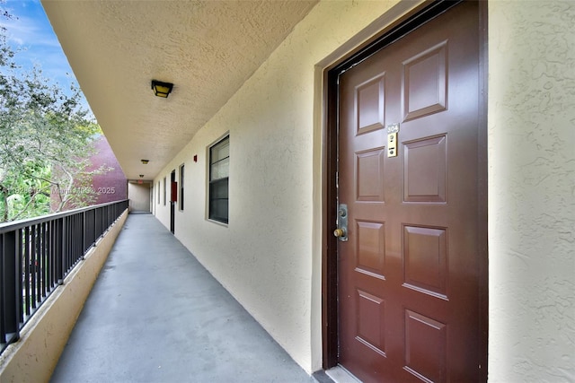 10501 W Broward Blvd Unit 304, Plantation, FL 33324 - entrance to property with stucco siding and a balcony