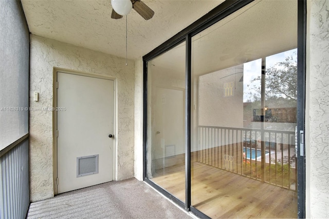 10501 W Broward Blvd Unit 304, Plantation, FL 33324 - balcony featuring ceiling fan and view of pool