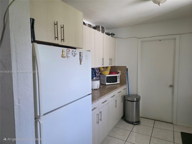 2237 NW 50th St, Miami, FL 33142 - kitchen featuring white appliances and light tile patterned flooring