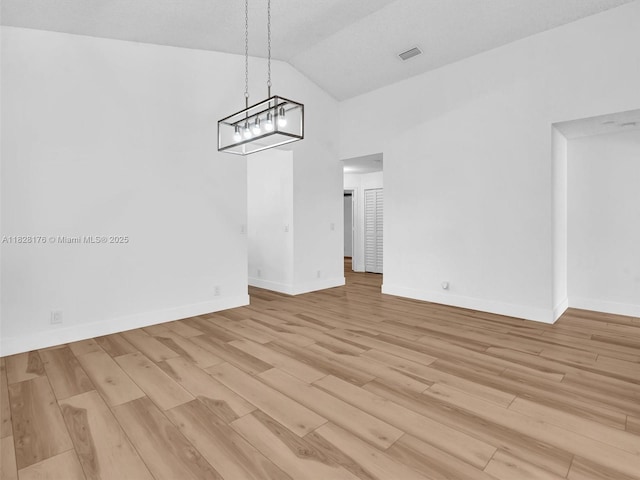 10370 NW 11th St, Plantation, FL 33322 - unfurnished dining area featuring light wood-style floors, a chandelier, and high vaulted ceiling