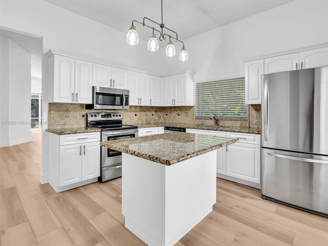 10370 NW 11th St, Plantation, FL 33322 - kitchen with stainless steel appliances, dark stone counters, and white cabinetry
