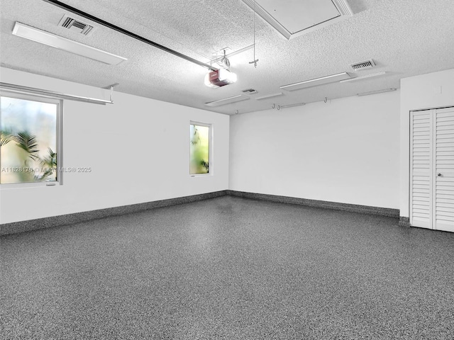 10370 NW 11th St, Plantation, FL 33322 - garage featuring a garage door opener and baseboards