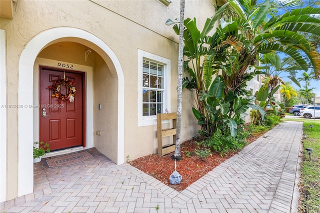 9052 Plymouth Pl Unit 9052, Tamarac, FL 33321 - view of exterior entry featuring stucco siding