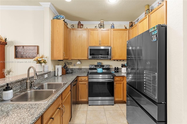9052 Plymouth Pl Unit 9052, Tamarac, FL 33321 - kitchen featuring stainless steel appliances, light tile patterned floors, crown molding, and stone countertops