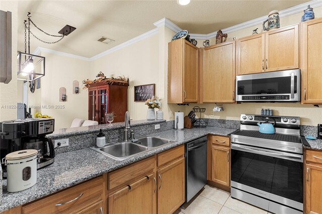 9052 Plymouth Pl Unit 9052, Tamarac, FL 33321 - kitchen featuring appliances with stainless steel finishes, ornamental molding, light tile patterned floors, dark stone counters, and decorative light fixtures