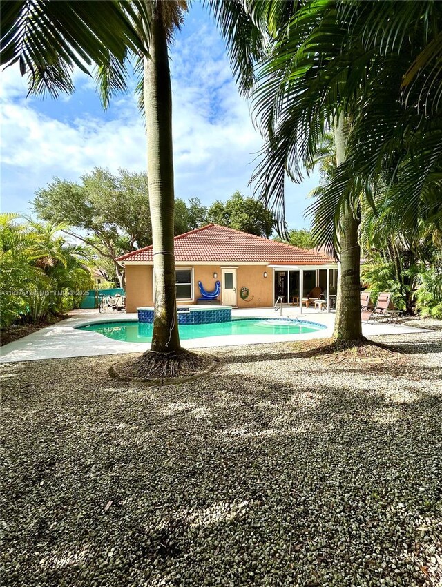 1084 Aspri Way, Riviera Beach, FL 33418 - outdoor pool featuring a patio