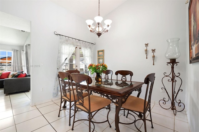5143 SW 142nd Pl, Miami, FL 33175 - dining space with a chandelier, light tile patterned flooring, and high vaulted ceiling