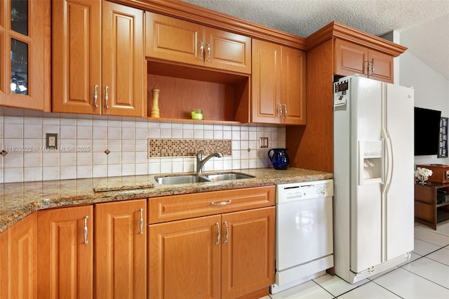 5143 SW 142nd Pl, Miami, FL 33175 - kitchen with white appliances, light tile patterned floors, light stone countertops, decorative backsplash, and a textured ceiling