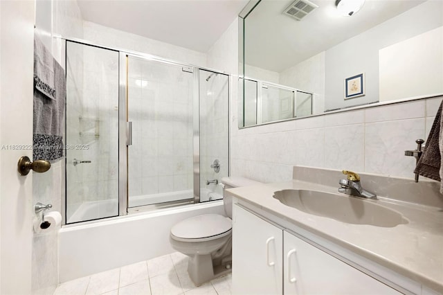 5143 SW 142nd Pl, Miami, FL 33175 - full bath with vanity, combined bath / shower with glass door, tile walls, and tile patterned flooring