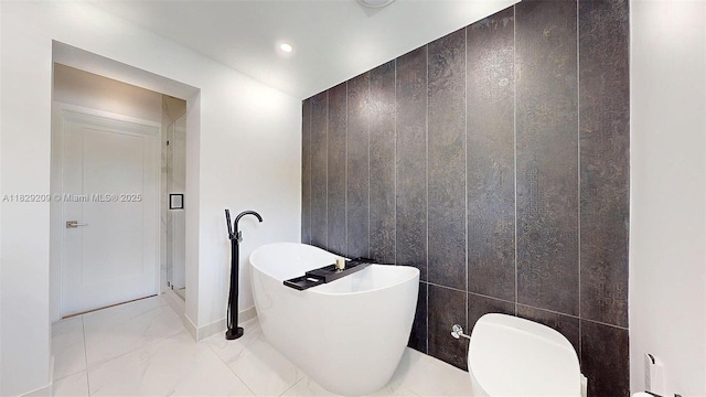 1222 Cortez St, Coral Gables, FL 33134 - full bathroom with marble look tiles, a soaking tub, and recessed lighting