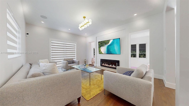 1222 Cortez St, Coral Gables, FL 33134 - living room featuring dark wood-style floors, a glass covered fireplace, plenty of natural light, and recessed lighting