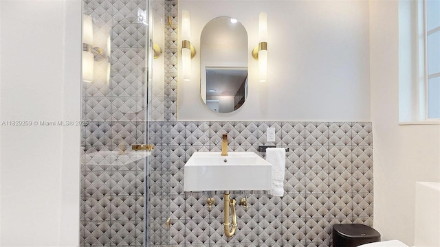 1222 Cortez St, Coral Gables, FL 33134 - bathroom featuring tile walls and a tile shower
