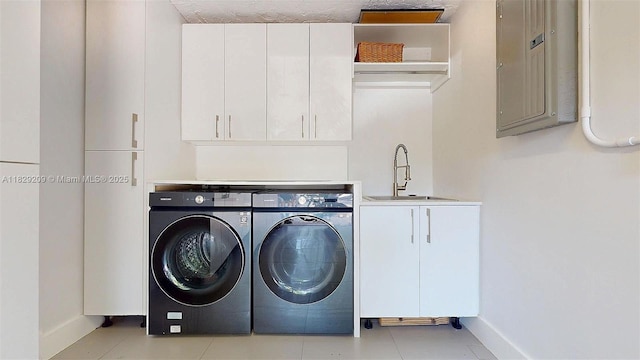 1222 Cortez St, Coral Gables, FL 33134 - washroom with washer and dryer, cabinet space, electric panel, and light tile patterned floors