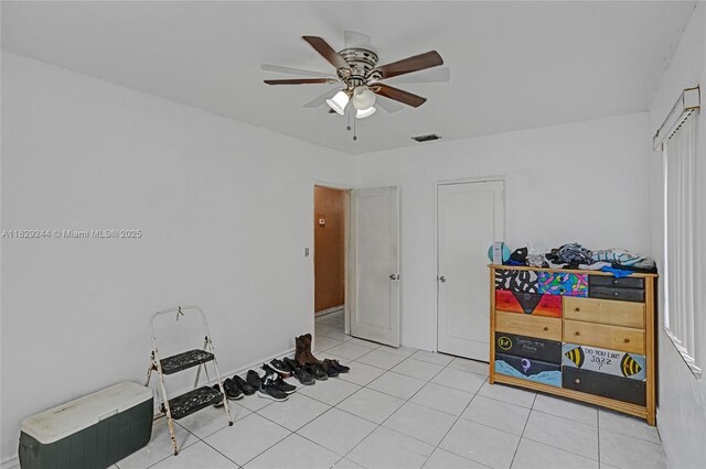 100 SW 67th Ct, Miami, FL 33144 - spare room with ceiling fan and light tile patterned floors