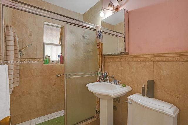 100 SW 67th Ct, Miami, FL 33144 - full bathroom featuring a stall shower, tile walls, and wainscoting