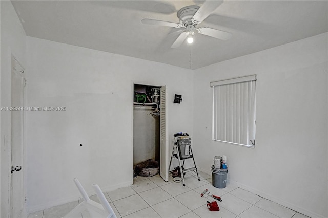100 SW 67th Ct, Miami, FL 33144 - unfurnished bedroom with a closet, a ceiling fan, and light tile patterned flooring