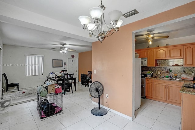 100 SW 67th Ct, Miami, FL 33144 - kitchen featuring stainless steel electric range oven, ceiling fan, backsplash, and light tile patterned floors